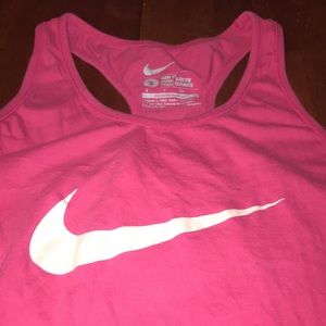 Bad lighting but the first pic is it’s actual color. It’s a bright pink tank top